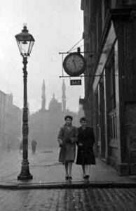 Image of the Clock Bar Bedford Street Gorbals with two ladies walking by