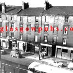 Exterior view of Springburn Road with Dougan's Bar on the left 1960s